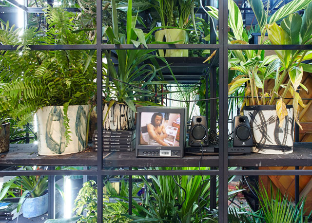 Rashid Johnson. Antoine's Organ, 2016. Black steel, grow lights, plants, wood, shea butter, books, monitors, rugs, piano, 480.1 x 858.5 x 321.9 cm (189 x 338 x 126 3/4 in).