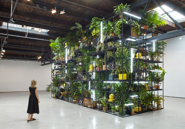 Rashid Johnson. Antoine's Organ, 2016. Black steel, grow lights, plants, wood, shea butter, books, monitors, rugs, piano, 480.1 x 858.5 x 321.9 cm (189 x 338 x 126 3/4 in).