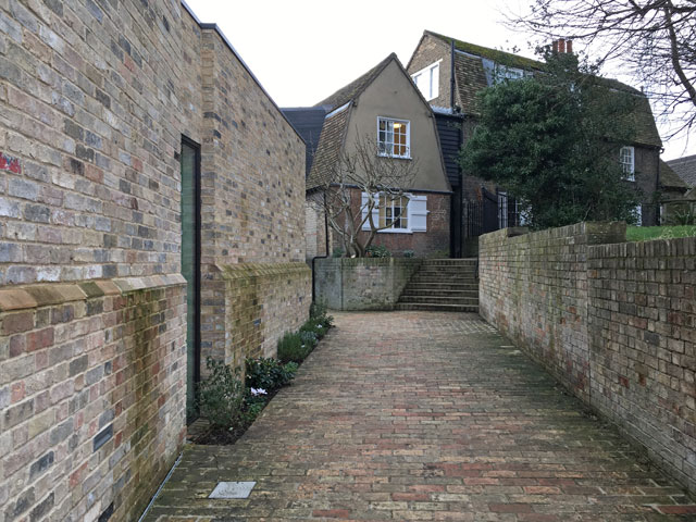 Kettle's Yard, Cambridge. Up the brick path to cottages (top). New entrance and galleries (left). Photograph: Veronica Simpson.