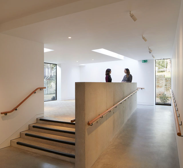 Kettle's Yard, Cambridge. Graduated thresholds from brick to concrete in new foyer. Fobert Architects © Hufton+Crow.