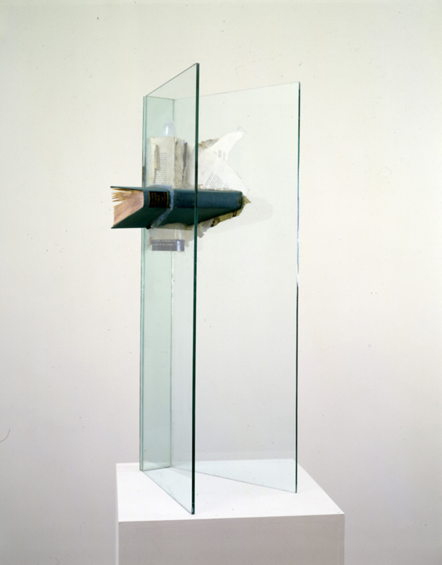 John Latham. Moral High Ground, 1988. Books, light bulb, glass, 83 x 25.5 x 33 cm. Courtesy John Latham Estate.