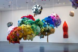 Mike Kelley. Deodorized Central Mass with Satellites, 1991/1999. Plush toys sewn over wood and wire frames with styrofoam packing material, nylon rope, pulleys, steel hardware and hanging plates, fibreglass, car paint and disinfectant. Overall dimensions variable. © Estate of Mike Kelley. Images courtesy of Perry Rubenstein Gallery, Los Angeles. Photography: Joshua White/JWPictures.com.