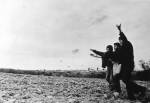 Gnezdo (Nest) Group (Mikhail Roshal, Gennadii Donskoi, and Viktor Skersis, active 1975-1978). Sowing, Help to the Soviet State in the Struggle for the Harvest, 1976. The action took place in the vicinity of Novokosino (Moscow region). Silver gelatin print. Courtesy of the Kolodzei Art Foundation.