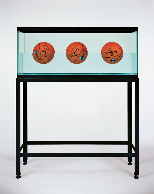 Jeff Koons. Three Ball 50-50 Tank (Spalding Dr. JK Silver Series), 1985. Glass, steel, distilled water, three basketballs, 60 1/2 x 48 3/4 x 13 1/4 in (153.7 x 123.8 x 33.7 cm). Edition of 2. © Jeff Koons.