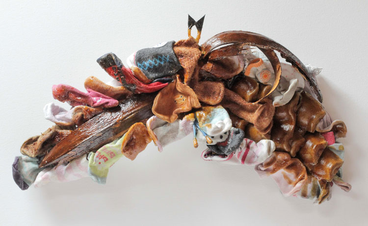 Lana Locke. Pangolin-Bat, 2020. Mixed media relief, 26 x 47 x 9 cm. © Lana Locke.