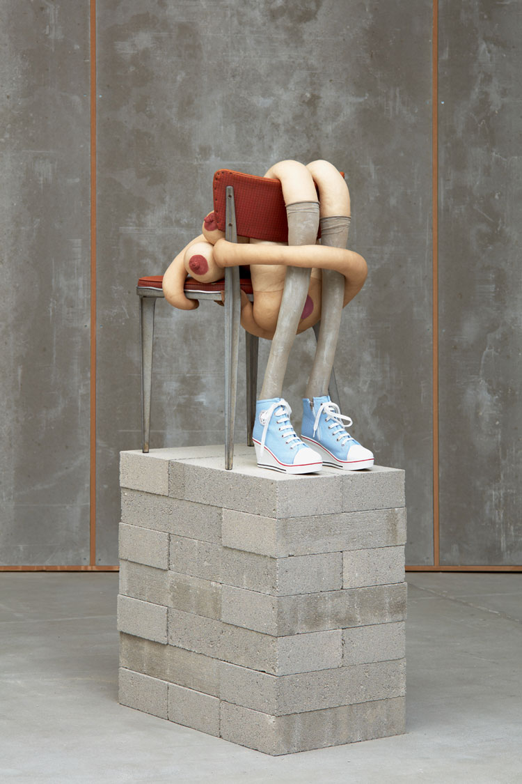 Sarah Lucas, Peeping Thomasina, 2020. Tights, wire, kapok, shoes, acrylic paint, vinyl and metal chair, 81 x 46 x 6cm plus plinth, 68.1 x 43 x 65.2 cm. Image courtesy of Sadie Coles. © Sarah Lucas, courtesy Sadie Coles HQ, London. Photo: Robert Glowacki.