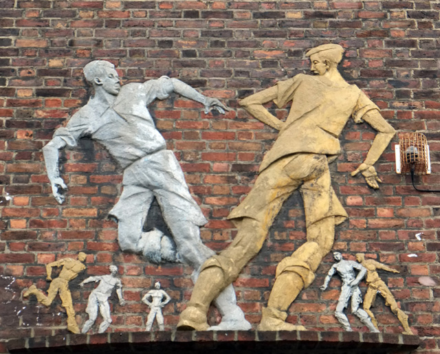 Peter Perí, Footballers, 1949. Coloured concrete. Wareham House, Fentiman Road, former LCC Estate, Lambeth, London. Photo: Nick Wright.