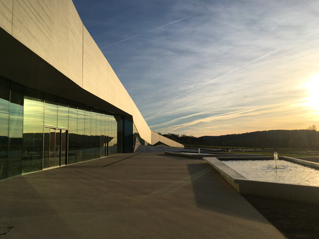 The glazed façade of Lascaux IV at dusk. Photograph: Veronica Simpson.