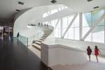 Pierre Lassonde Pavilion, Musée National des Beaux-Arts du Québec. 'The star of the Grand Hall is a glamorous white staircase.' Photograph: Bruce Damonte. © OMA.