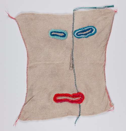 Hayley Newman. Bubblegum coloured cloth with embroidered mouth, eyes and nose from the series Domestique, 2010-12, 42 cm x 37 cm.