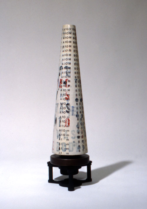 Liliane Lijn. Atom Body Was Light Poemcon, 1964. Letraset and paint on wood cone, turntable, motor, 40.7 x 11.5 x 17.2 cm. Text by Nazli Nour. Collection: Leeds City Art Gallery. Made in Athens. Photograph: Liliane Lijn