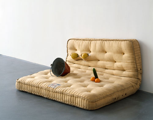 Sarah Lucas. Au Naturel, 1994. Mattress, water bucket, melons, oranges and cucumber, 84 x 168 x 145cm. Copyright the artist, courtesy Sadie Coles HQ, London.