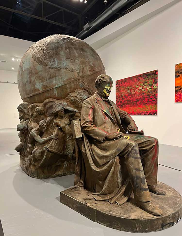 Matthew Fontaine Maury statue next to Walter Price’s series Cadence, 2022-24. Installation view, Monuments, The Geffen Contemporary at MOCA. Courtesy of The Museum of Contemporary Art (MOCA) and The Brick. Photo: Jill Spalding.