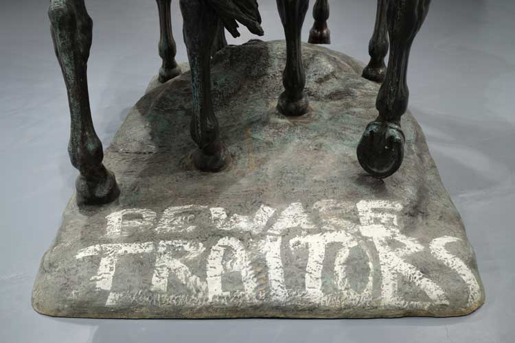BEWARE TRAITORS spray-painted on the base of Laura Gardin Fraser's statue of generals Stonewall Jackson and Robert E Lee. Installation view, Monuments, The Geffen Contemporary at MOCA. Courtesy of The Museum of Contemporary Art (MOCA) and The Brick. Photo: Fredrik Nilsen.
