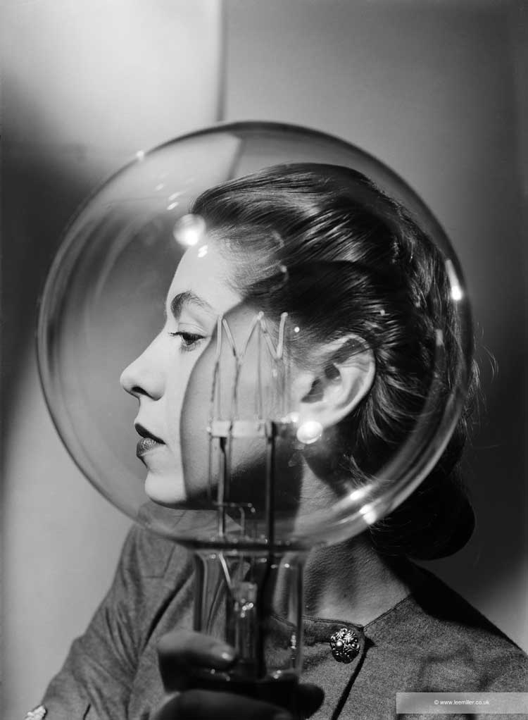 Lee Miller, Model with Lightbulb, c1943. Lee Miller Archives. © Lee Miller Archives, England 2025. All rights reserved. leemiller.co.uk.