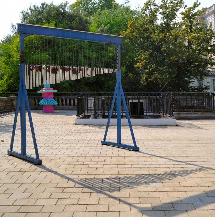 Virginia Overton, Untitled (chime for Caro), 2022. Installation view, Mary Mary, Artist’s Garden, Temple Place, London. Image courtesy theCOLAB The Artist's Garden. Photo © Nick Turpin.