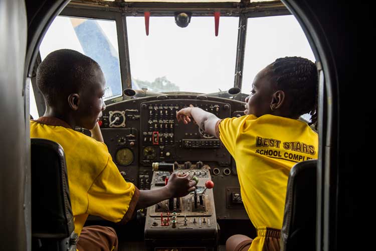 School children enjoying a lesson in the Red Clay Studio's airplane classroom. Photo © Savannah Centre for Contemporary Art