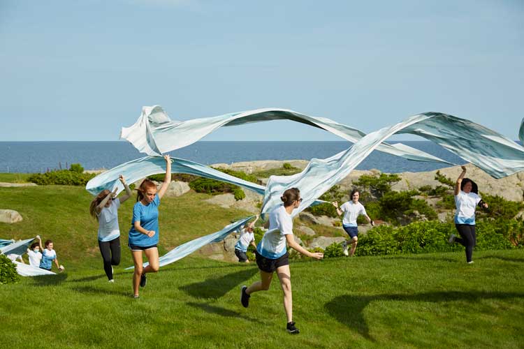 Melissa McGill. In the Waves, 2021. Performance at Rough Point, Newport, Rhode Island. Photo: Caroline Goddard for Tom Powel Imaging.