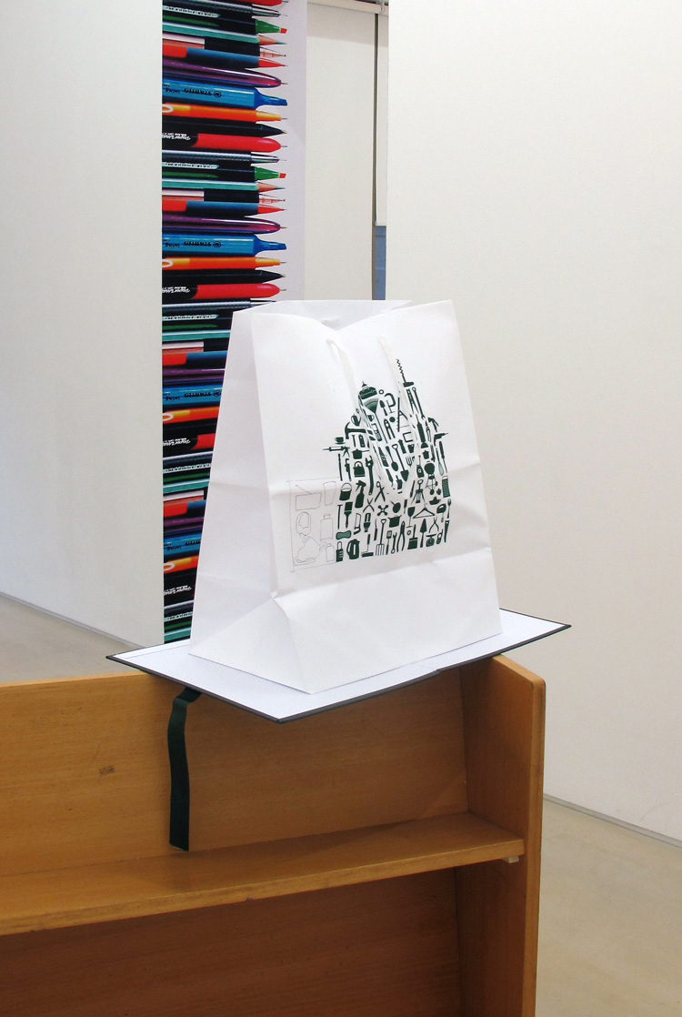 Sara MacKillop, Carrier bag book (Robert Dyas extended), Digital print on paper, cotton tape and folder, 50 x 42 x 29.7 cm unfolded. Installation view, PEER and Shoreditch Library, Hoxton, London, 2019. Courtesy PEER, copyright Sara MacKillop. Photo: Stephen White.