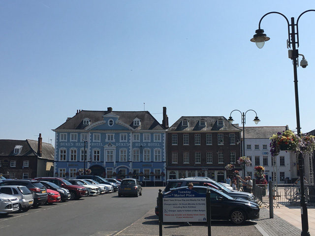 Tuesday Market Place - now a car park, but much of the historic architecture remains including the original 19th-Century Corn Exchange and Duke’s Head Hotel, c1680s. Photo: Catherine Mason.