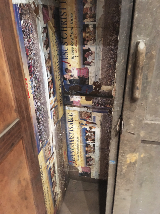 Ibrahim Mahama, The Archive, detail of cabinet lined with evangelical posters. Installation view, Whitworth Art Gallery, Manchester, 2019. Photo: Veronica Simpson.