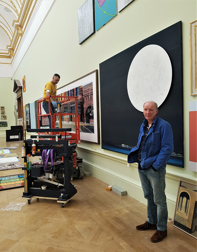 Jock McFadyen at The Royal Academy of Arts Summer Exhibition 2019 hang. Photo: Juliet Rix.