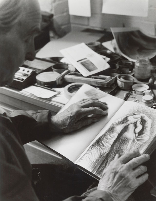 Moore with The Artist’s Hands c1974, a page from Red Notebook 1969-77, in Gildmore Graphics Studios, Perry Green, 1976. Reproduced by permission of The Henry Moore Foundation. © The Henry Moore Foundation. Photo: Bo Boustedt.