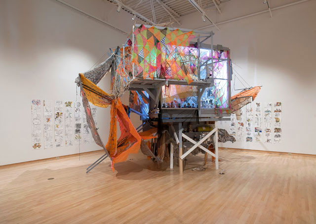 Makeshift installation view at the John Michael Kohler Arts Center, 2018. Greg Smith, TINA (There Is No Alternative), 2018, mixed media. Background: Greg Smith, untitled, 2018, graphite and coloured pencil on paper.