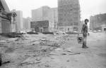 Gordon Matta-Clark creating Garbage Wall under the Brooklyn Bridge in 1970. © The Estate of Gordon Matta-Clark / Artists Rights Society (ARS), New York. Courtesy The Estate of Gordon Matta-Clark and David Zwirner.