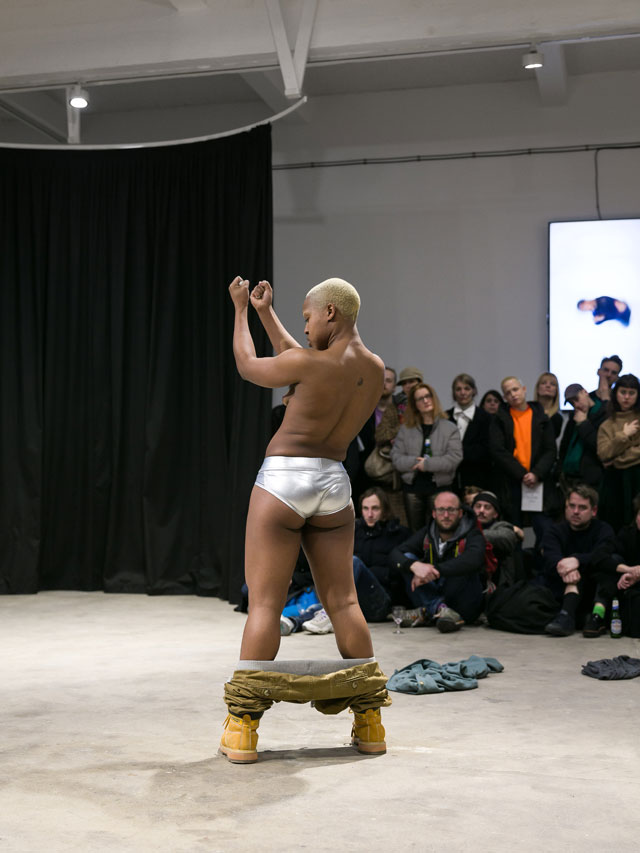 Layo (Titilayo Adebayo) performing as go-go dancer, Paul Maheke, A fire circle for a public hearing, 2018, Chisenhale Gallery, 2018.