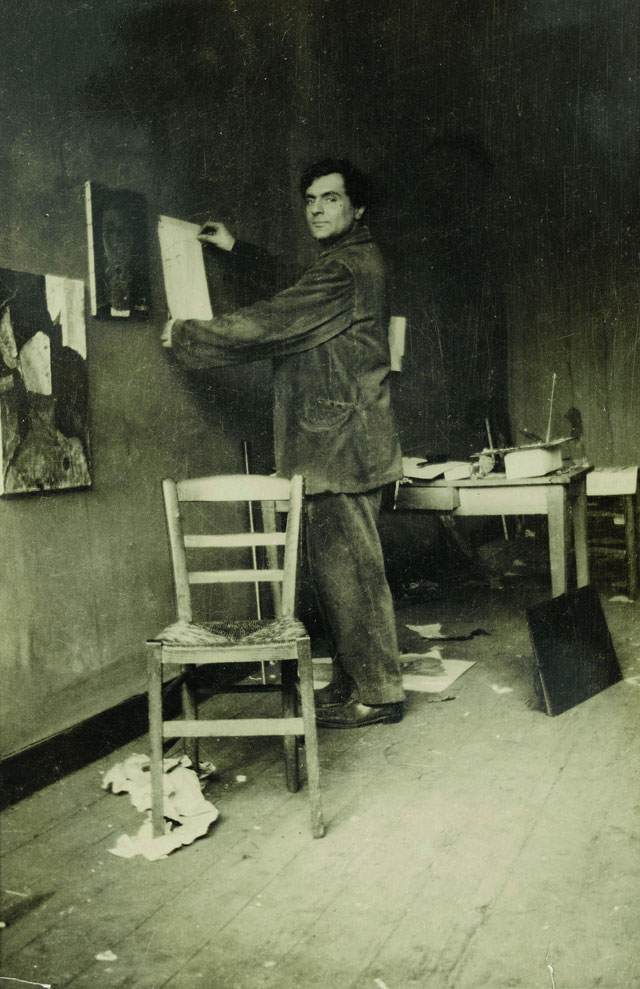 Modigliani in his studio, photograph by Paul Guillaume, c1915. © RMN-Grand Palais (musée de l’Orangerie) I Archives Alain Bouret, image Dominique Couto.