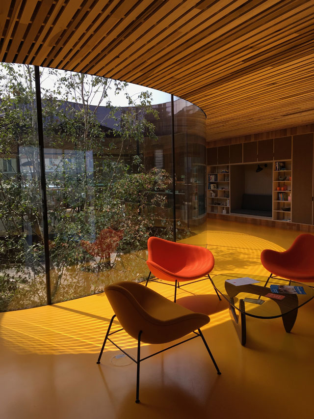 Interior view with poured resin floor of sunshine yellow, Maggie’s Centre for cancer care, Oldham. Photograph: Veronica Simpson.