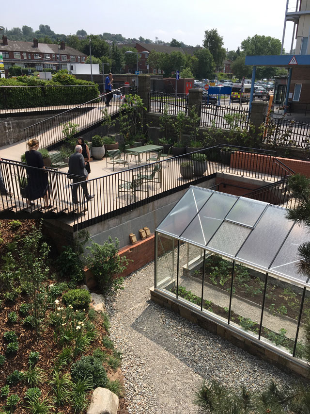 The garden includes a greenhouse for gardening therapy, Maggie’s Centre for cancer care, Oldham.