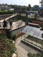 The garden includes a greenhouse for gardening therapy, Maggie’s Centre for cancer care, Oldham.