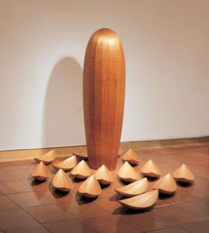 Donald Fortescue. <em>Self-Contained</em>, 2000-2001. Laminated and coopered mahogany with pyrographed markings, Laminated and coopered mahogany (Pod): 80 x 23 x 23in. (203.2 x 58.4 x 58.4cm) (Hulls): 5 1/2 x 27 x 9 1/2in. (14 x 68.6 x 24.1cm) each. Overall: Variable Dimensions. Museum of Arts & Design, New York. Museum purchase with funds provided by Simon Blattner, Marcia Docter, The Horace W. Goldsmith Foundation and The Wornick Family Foundation, 2005. Photo credit: Jeff Sturges, 2006.