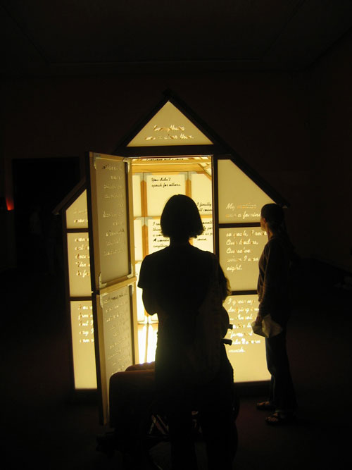 Mary Kelly and Ray Barrie. Love Songs, 2005–7. Multi-Story House, 2007. Wooden frame, cast acrylic panels, plate glass floor, fluorescent light, 244 x 183 x 244 cm. Courtesy Jose Carlos Teixeira and the artist. Collection of the artist.