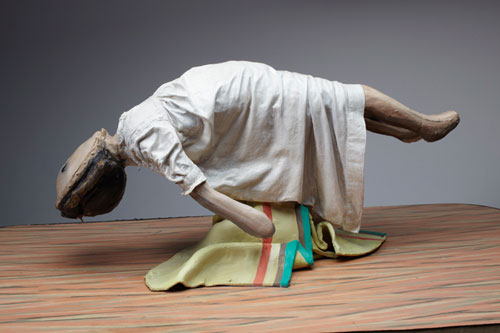 Cathie Pilkington. <em>Levitating Doll</em>, 2010. Wood, steel, clay, fabric, lino, paint 28 x 90 x 52 cm.  © the artist and Space Station Sixty-Five. Photo: Graham Challifour.