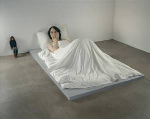 Ron Mueck. <em>In Bed</em>, 2005. Mixed media. 162 x 650 x 395cm © Ron Mueck, courtesy Anthony d'Offay, London. Photographer: Mike Bruce, Gate Studios, London.