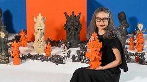 The artist explains feeling that she belonged neither to the Vietnamese community of her heritage or the Australian one of her birth led her to translate centuries-old Vietnamese wood carvings into her own artworks in clay and how through her Vomit Girl installations she creates a community of her own