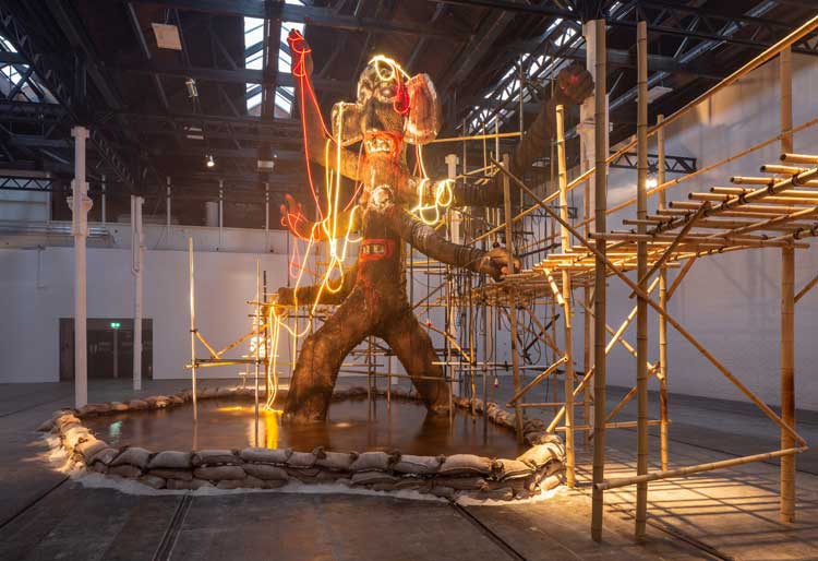 Ramesh Mario Nithiyendran. Multi Limbed Mud Fountain, 2023. Mud cob, straw, paint, LED rope, electrical cable. Photo courtesy Tramway.