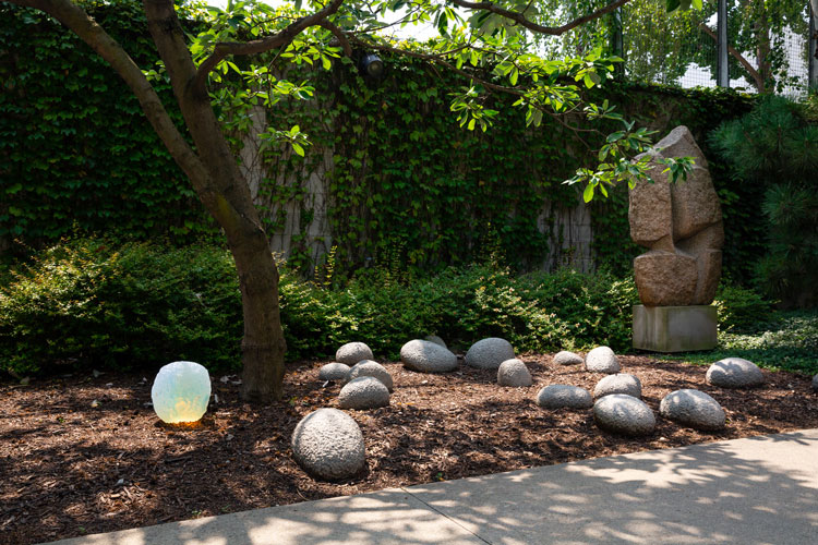 Objects of Common Interest, Offerings–Rock III, 2000, joins Isamu Noguchi’s Practice Rocks in Placement, 1982–83. Photo: Brian W. Ferry. ©INFGM / ARS.