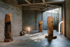 Objects of Common Interest, Tube Light I and Tube Light II, 2019, installed among Isamu Noguchi’s late-career basalt and Manazuru stone sculptures in The Noguchi Museum’s indoor-outdoor gallery, Area 1. Photo: Brian W. Ferry. ©INFGM / ARS.