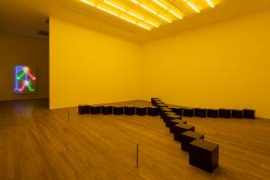 Bruce Nauman. Black Marble Under Yellow Light, 1987. Installation view, Tate Modern. Photo: Tate Photography (Matt Greenwood). Artwork © Bruce Nauman / ARS, NY and DACS, London 2020.