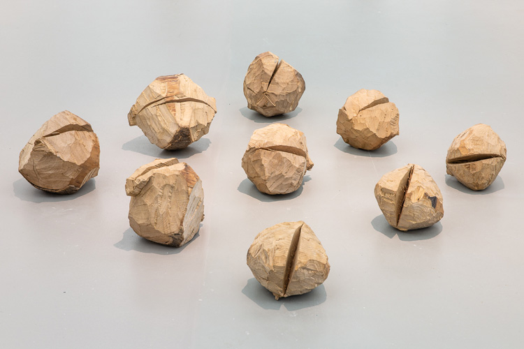 David Nash. Nine Cracked Balls, 1970-71. Installation view, Towner Art Gallery, Eastbourne, 2019. Photo: Rob Harris.