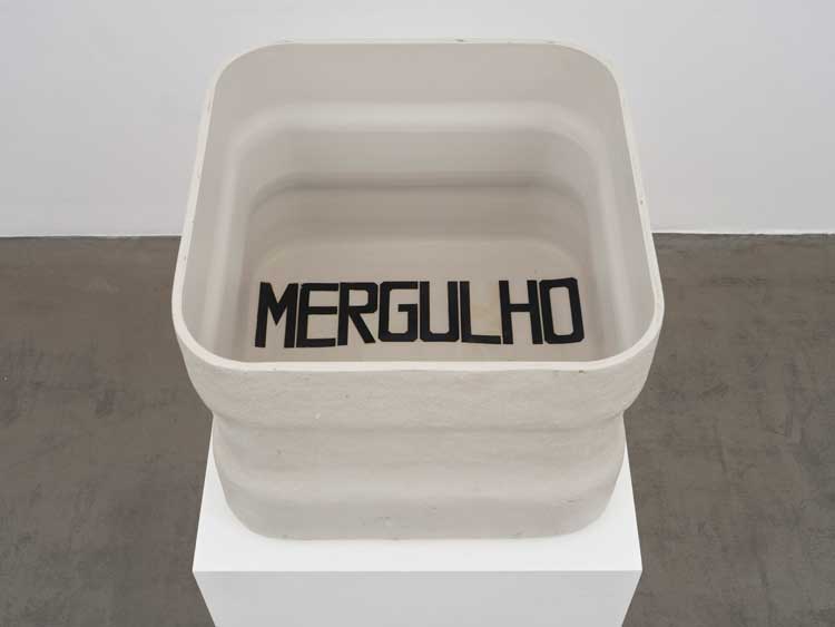 Hélio Oiticica. B47 Bólide caixa 22 'Mergulho do corpo' (B47 Box Bólide 22 'The Plunge of the Body'), 1966-67. Water tank and rubber letters, 49 x 62.5 x 62.5 cm (19 1/4 x 24 1/2 x 24 1/2 in). © Estate of Hélio Oiticica, Courtesy Lisson Gallery.