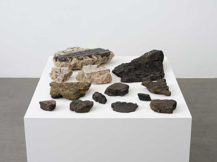 Hélio Oiticica. Apropriação 4 – Avenida Presidente Vargas-Gaudí-Kioto – Objet semi-mágico-trouvé (Appropriation 4 – Avenida Presidente Vargas-Gaudí-Kyoto – Semimagical Found Object), 1978. Asphalt fragments, Installed dimensions: 14 x 119 x 89 cm (5 1/2 x 46 3/4 x 35 in). © Estate of Hélio Oiticica, Courtesy Lisson Gallery.