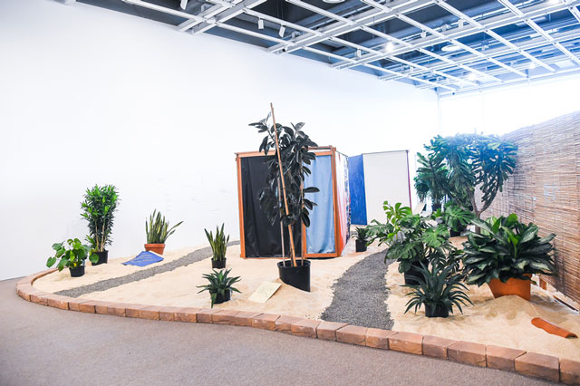 Hélio Oiticica. Installation view.  Tropicália, 1966-67. Plants, sand, birds, poems by Roberta Camila Salgado on bricks, tiles and vinyl squares. Collection of César and Claudio Oiticica. Photograph by Matt Casarella