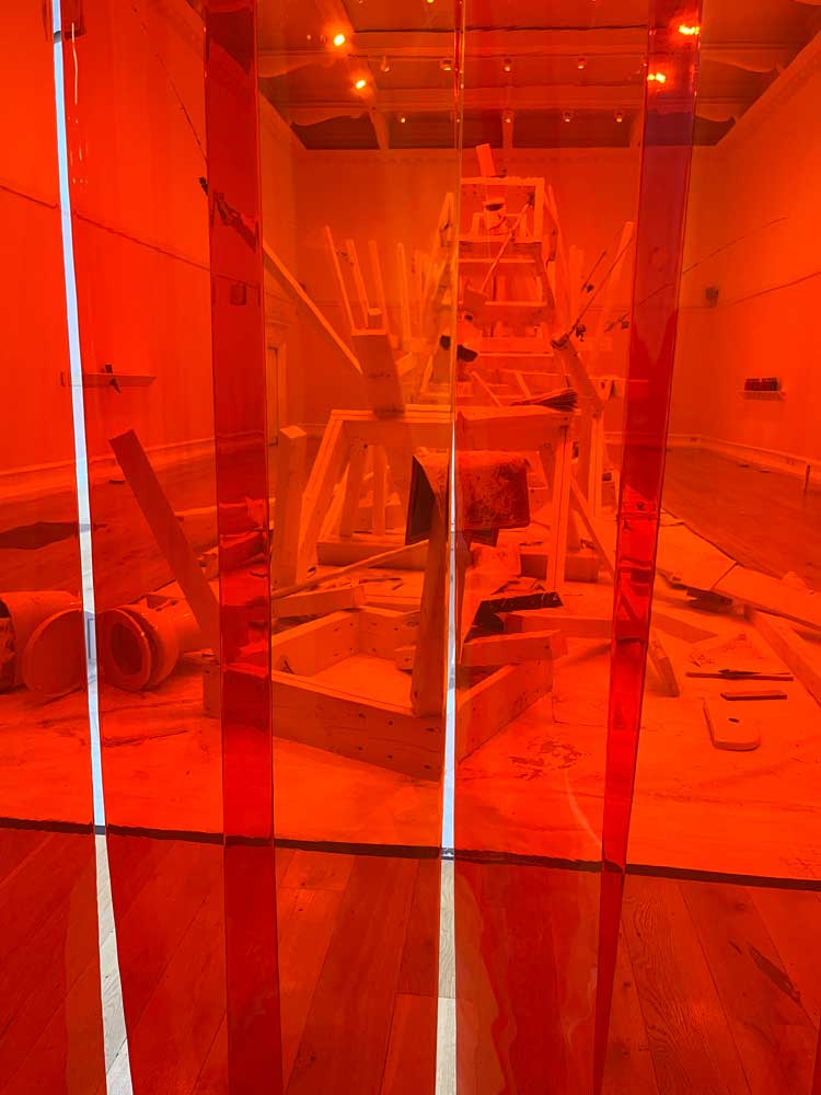 Red plastic 'butcher’s shop' strips, installation view, William Pope.L: Hospital, South London Gallery, 21 November 2023 – 11 February 2024. Photo: Veronica Simpson.