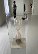 Katie Paterson, The Moment, 2022. A hand-blown hourglass filled with some of the most ancient material on earth. Installation view, Galleri F15, Moss, Norway. Photo: Veronica Simpson.