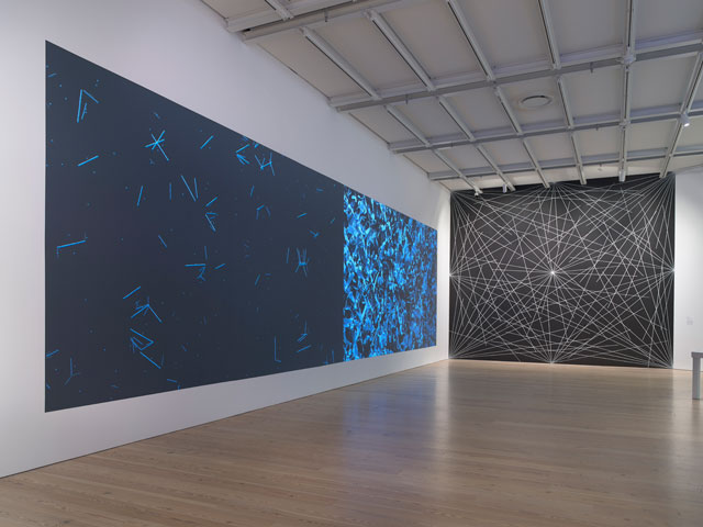 Installation view of Programmed: Rules, Codes, and Choreographies in Art, 1965-2018 (Whitney Museum of American Art, New York, September 28, 2018-April 14, 2019). From left to right: Casey Reas, {Software} Structure #003 A, 2004 and 2016; Casey Reas, {Software} Structure #003 B, 2004 and 2016; Sol LeWitt, 4th Wall: 24 lines from the center, 12 lines from the midpoint of each of the sides, 12 lines from each corner, 1976. Photograph: Ron Amstutz.